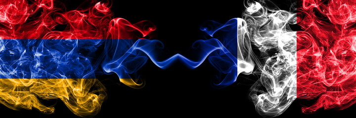 Armenia vs France, French smoky mystic flags placed side by side. Thick colored silky abstract smoke flags