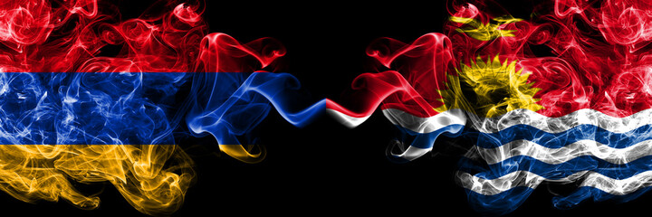 Armenia vs Kiribati smoky mystic flags placed side by side. Thick colored silky abstract smoke flags
