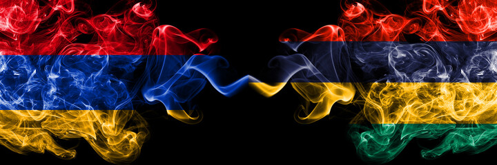 Armenia vs Mauritius, Mauritian smoky mystic flags placed side by side. Thick colored silky abstract smoke flags