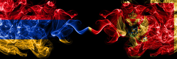 Armenia vs Montenegro, Montenegrin smoky mystic flags placed side by side. Thick colored silky abstract smoke flags