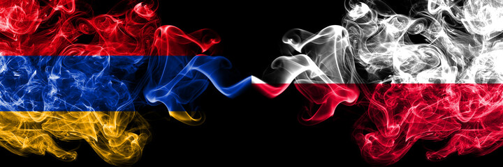 Armenia vs Poland, Polish smoky mystic flags placed side by side. Thick colored silky abstract smoke flags