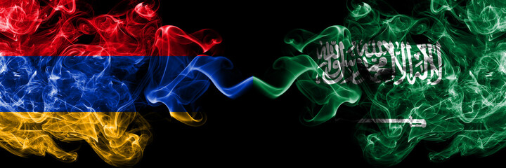 Armenia vs Saudi Arabia, Arabian smoky mystic flags placed side by side. Thick colored silky abstract smoke flags