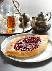 Sweet khachapuri with cream cheese and raspberry jam