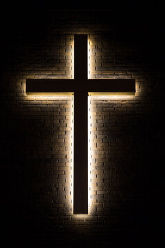 Illuminated Christian Cross In The Darkness