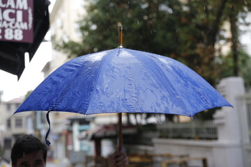 A rainy day and a blue umbrella
