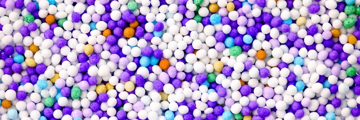 Little colorful eatable sugar pearls for food decoration. Panorama