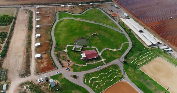 Aerial view above big house ranch or horse farm outdoor at the country. Huge barn view for farm animals outback. western drone real estate concept