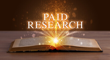 PAID RESEARCH inscription coming out from an open book, educational concept