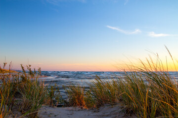 Fototapeta na wymiar Beach sunset landscape on the coast of Lake Michigan at Ludington State Park.