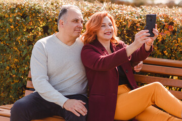 Fototapeta premium Middle-aged family takes selfie photo