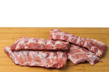 Close up view of raw pork ribs on wooden cutting broad. Cooking and food concept.