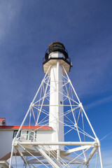 Whitefish Point lighthouse stands guard on the isolated Lake Superior shoreline. 