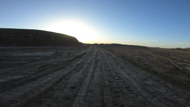 Running in the sunset yardang landform aera in China
