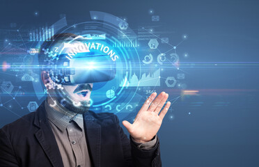 Fototapeta premium Businessman looking through Virtual Reality glasses with INNOVATIONS inscription, innovative technology concept