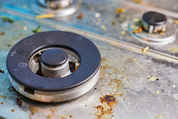 Dirty stove top with oil splatters, fat stains and food leftovers