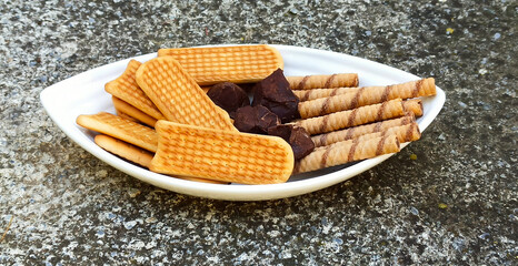 Chocolate bonbons , biscuits anmd rolled hazelnuts sticks