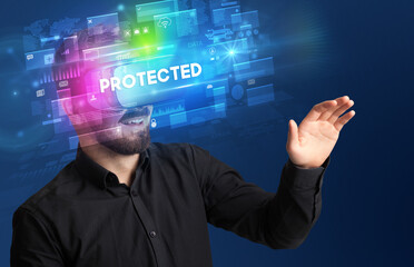 Businessman looking through Virtual Reality glasses with PROTECTED inscription, innovative security concept
