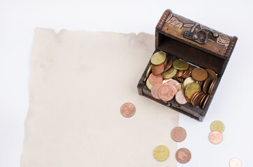Chest with money on white background. With Parchment on the left to write text