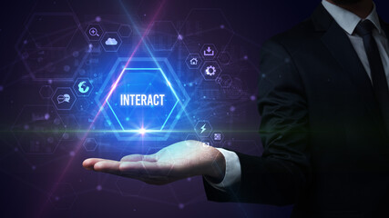 Man hand holding INTERACT inscription, social media concept
