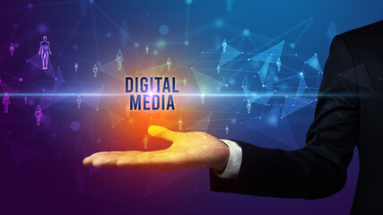 Elegant hand holding DIGITAL MEDIA inscription, social networking concept