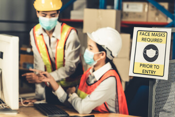 Caution sign in factory warning to industry labor worker to prevent Covid-19 Coronavirus spreading...
