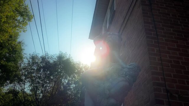 Lens Flare Over A Goddess Statue In South Philly