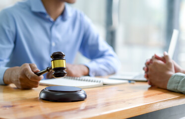 Close-up shot of Lawyer holding a hammer giving advice on the law,Concept of justice.