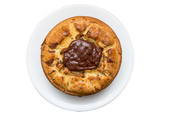 round shaped home baked golden brown pure butter cake topped up with pure chocolate with a crispy texture and super soft placed in a white ceramic plate on white background