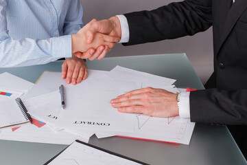 Businessman shaking partner hand after successful negotiations. Business people conclude a contract. Concept of cooperation.