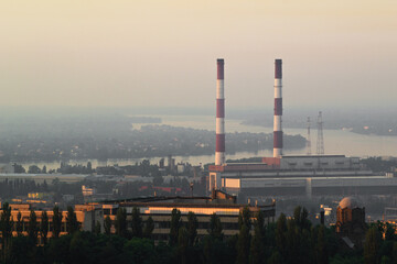 CHP-5, Vydubychi, Kiev, Ukraine. Station pipes at dawn. Dnipro river in the background