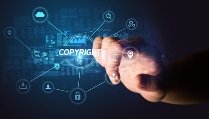 Hand touching COPYRIGHT inscription, Cybersecurity concept