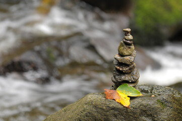 figures built of stones in a mountain creek