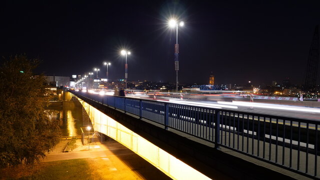 Night Timelapse, made with Long Exposure Pictures, of Cars and Vehicles with Light Trails over the Branko's Bridge (Brankov most) in Belgrade Serbia over the Sava River Water