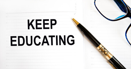 In the diary, keep a educating entry, a pen points to it. A business concept.