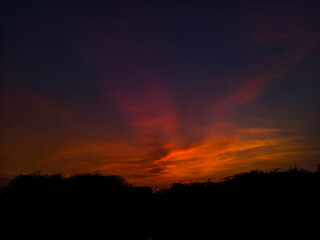 sunset with burning edges of the clouds