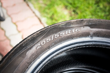 car tire size for sale represents the dimensions and construction type of tyre show on background © lukasz_kochanek