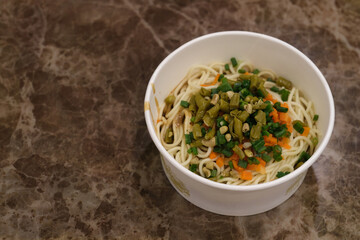 high angle view of a bowl of hot dry noodles with sesame paste. Traditional snack in Wuhan,Hubei,China