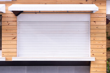 A closeup shot of automatic metal roller door used in factory, storage, garage, and industrial...