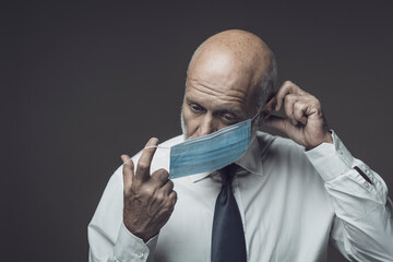 Corporate businessman wearing a face mask