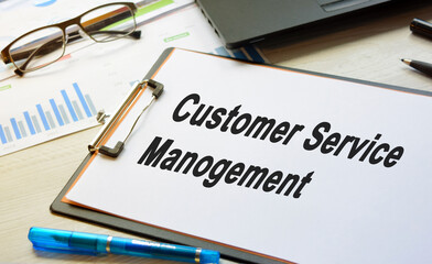 The inscription on business subjects on a white blank lying on the desktop with equipment. Business concept.