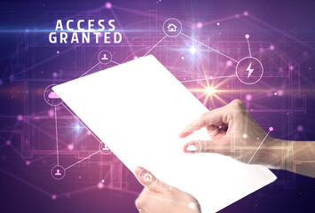 Holding futuristic tablet with ACCESS GRANTED inscription, cyber security concept