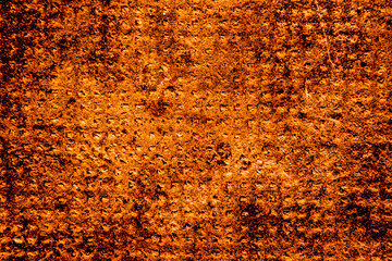 Copper colored wall texture background with textures of different shades of copper or bronze