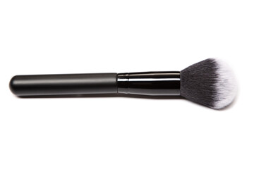 Brush for applying face makeup on a white background