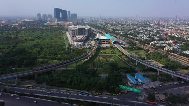 Untitled Project 17An aerial shot of the Delhi Metro entering Botanical Garden Metro Station at Noida,NCR,India 