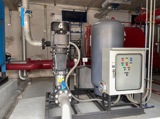 Pump rooms, pipes and valves in large industrial pumping stations