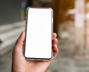 cell phone in hand, place for advertisement, inscriptions.Blank screen to put it on your own webpage or message.