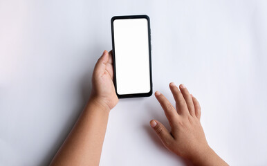 Closeup shot of a woman typing on mobile phone isolated on white background.Blank screen to put it on your own webpage or message.

