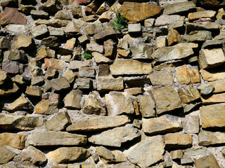 Naklejka premium Stary kamienny mur ze średniowiecznego zamku jako tło