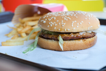 A delicious burger on a white plate