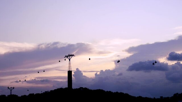 silhouette of singapore Ski elevator cable way transportation to sentosa island on the evening